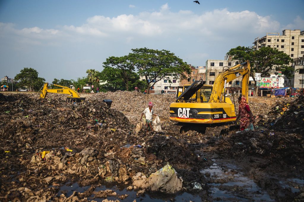 Yellow and Black Trucks on the Dumpsite